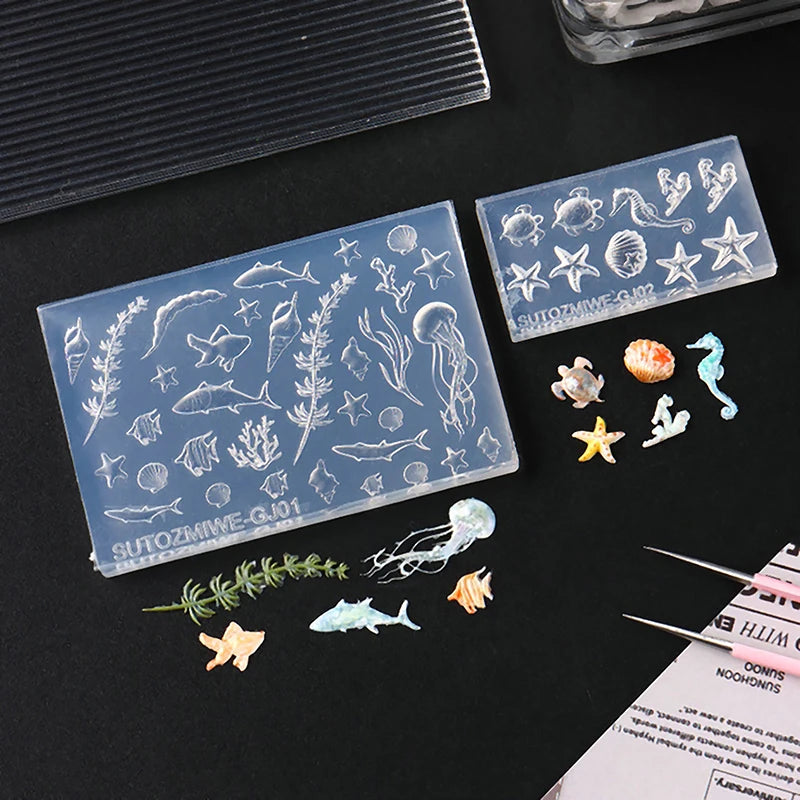 Clear silicone nail art molds featuring various sea creatures and marine life for DIY nail design