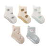 A set of five white and beige cartoon socks featuring various animal faces and patterns.