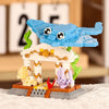 A LEGO building block set featuring a shark, crab, and clownfish figures built into a structure.