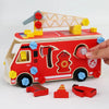 A wooden pretend play tool set featuring a wrench, screwdriver, and building pieces attached to a red vehicle.