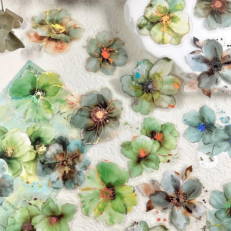 A collection of floral hot stamp stickers in various shades of green, blue, and yellow on a white background.