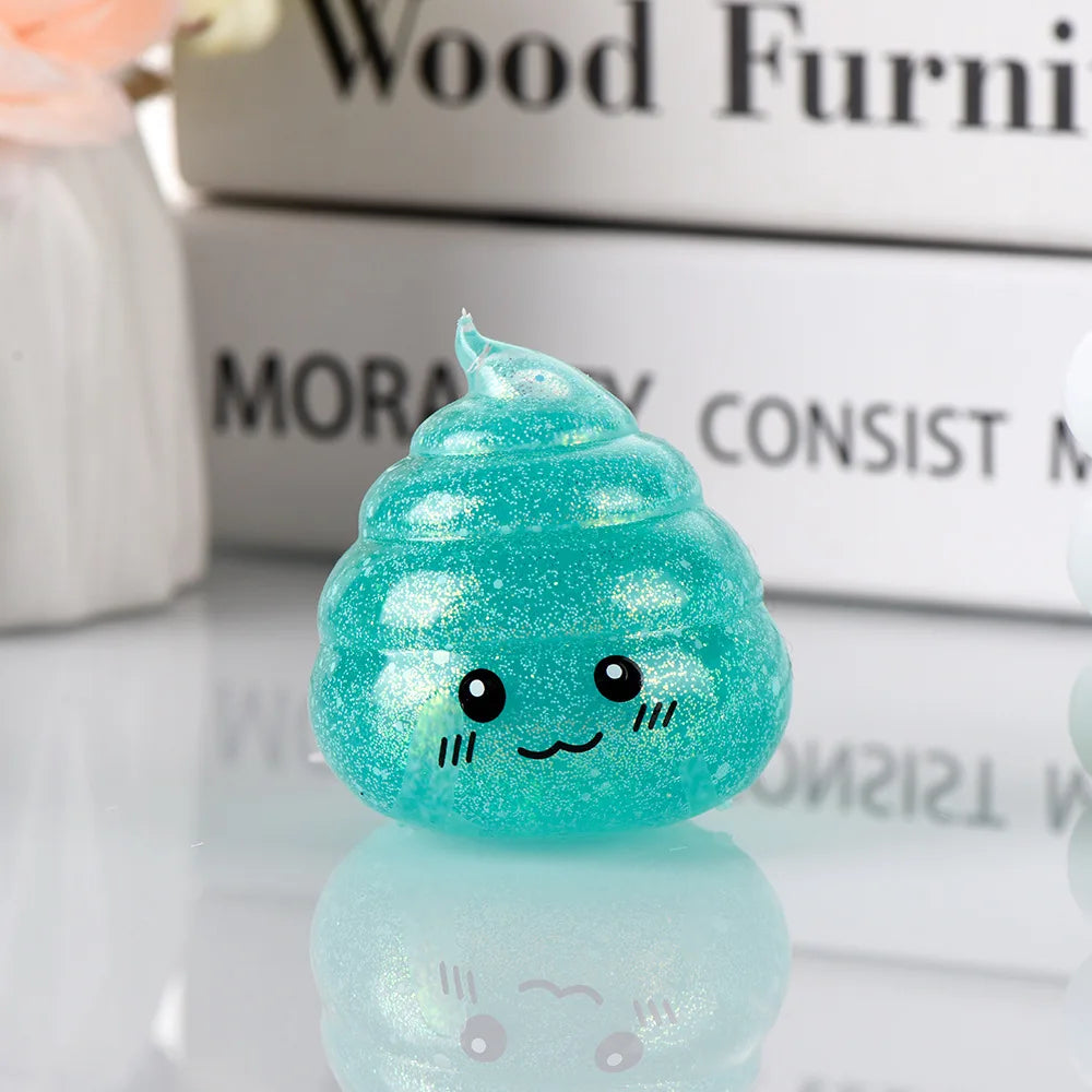A bright teal glitter squishy stress ball shaped like a cute, smiling face resting on a reflective surface.
