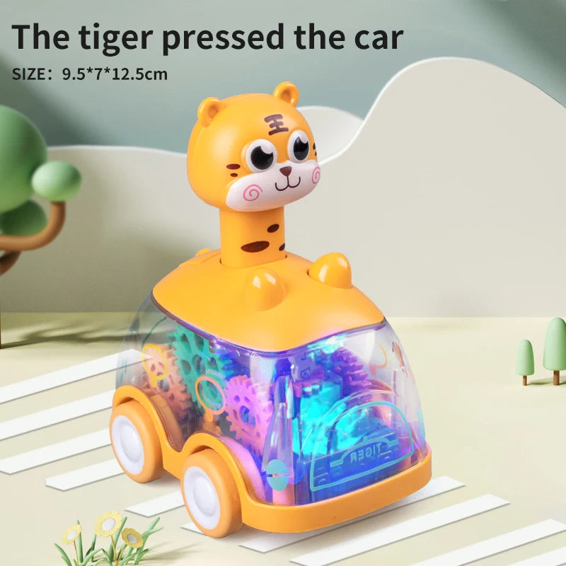 A yellow tiger-themed pull-back toy car is shown on a light surface.