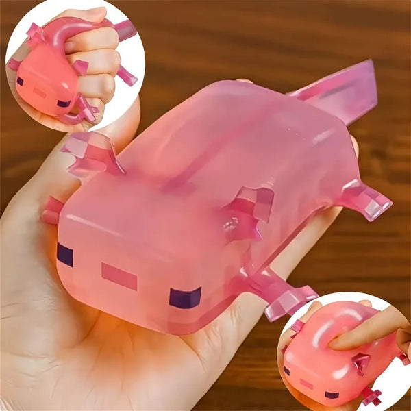 A hand holds a pink, squishy animated salamander fidget toy, showing both the full product and an inset view.