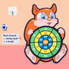 An orange cartoon fox character holding a dart board and a sticky ball for a game.