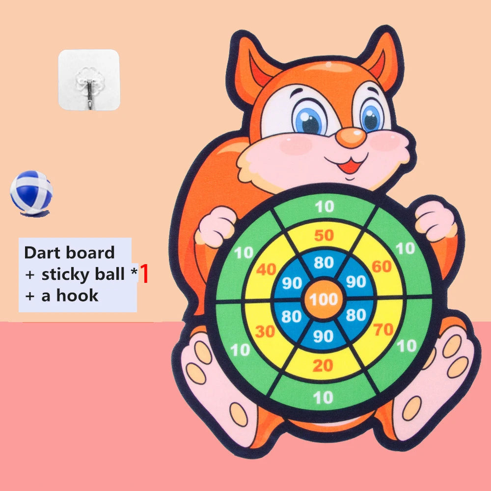An orange cartoon fox character holding a dart board and a sticky ball for a game.