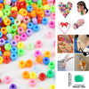 Assortment of solid color pony beads for jewelry making and craft projects shown in various arrangements.