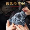 A close-up of a handcrafted Aztec death whistle with an eerie scream sound, held by a person wearing a black mask.