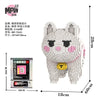 A white bear figure made of tiny building blocks, packaged with instructions and dimensions.
