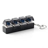 A black plastic key fob with five clear, illuminated keyboard keys attached to a silver keyring.