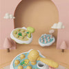 A set of wooden animal hammer toys for toddlers, including a duck and other animals, displayed in a nursery setting.