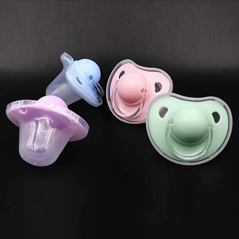 A set of two silicone pacifiers in light blue and pink with protective covers displayed against a dark background.