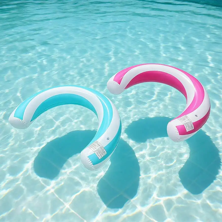 A pink and white striped inflatable U-shaped pool float floating in clear blue water.