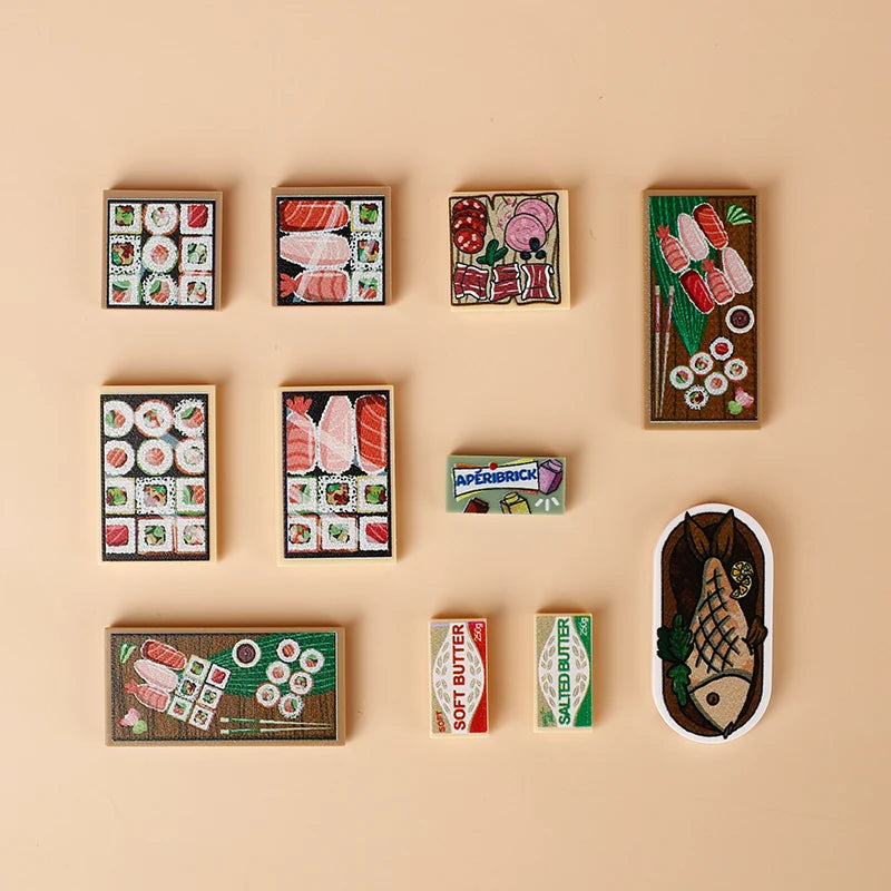 A collection of wooden building blocks shaped like food items including pizza, cake, and condiment bricks.