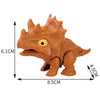 An orange finger dinosaur fidget toy with movable joints, showing its size and features.