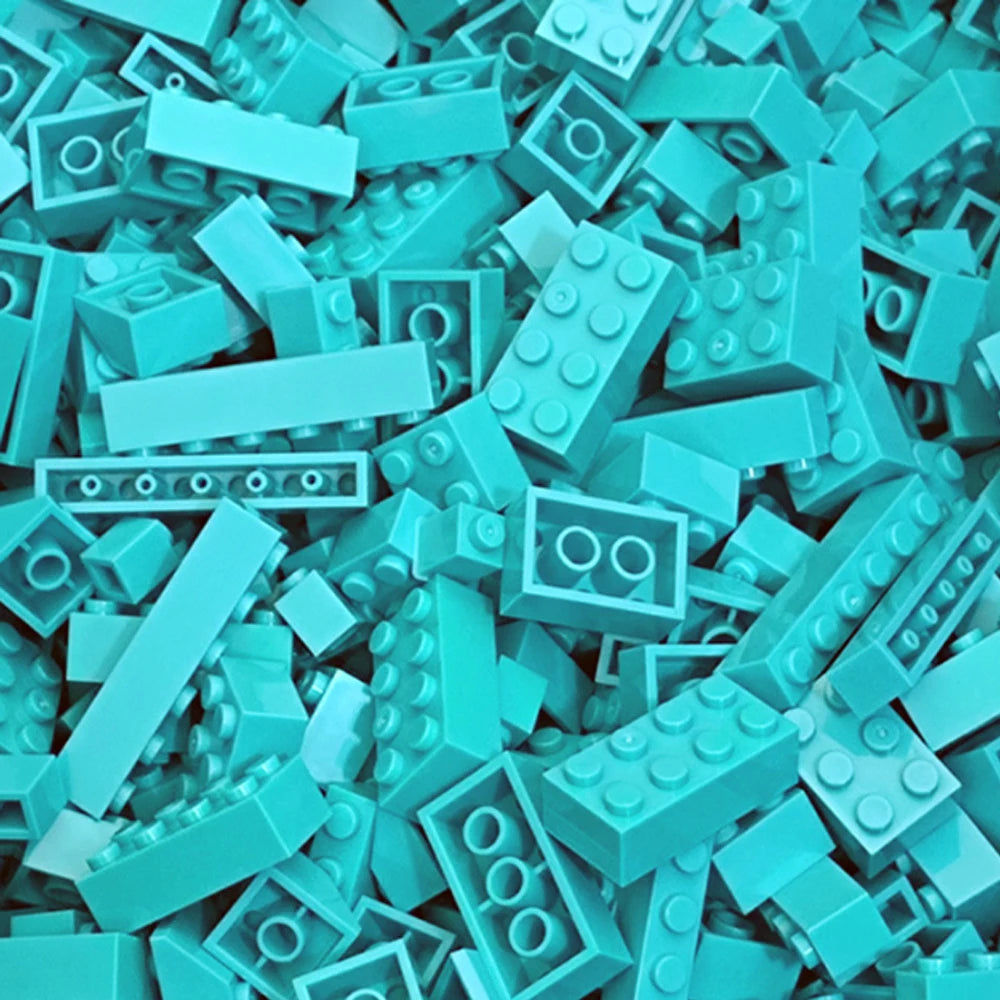A pile of teal and light blue building blocks for creative DIY projects.