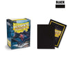 A black box of Dragon Shield card sleeves with a dragon design and a black sleeve is shown.