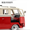 A red vintage style metal bus diecast model with a pull-back action, showing the interior view.