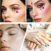 Close-up of a woman applying self-adhesive acrylic gem stickers to her face and nails for beauty and craft projects