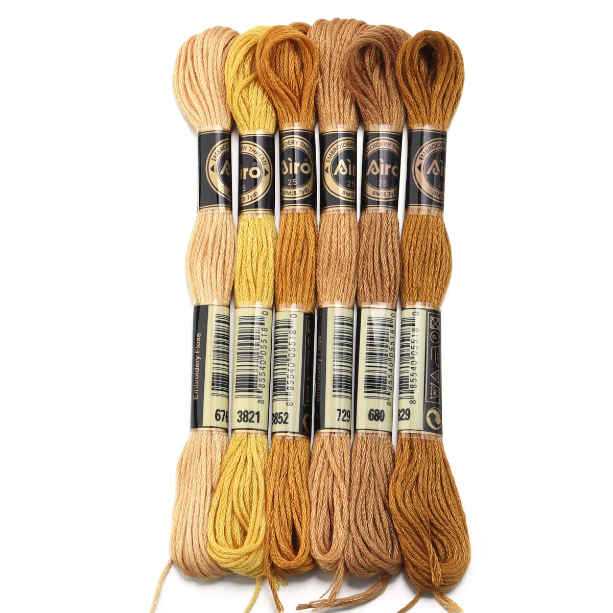 A set of six skeins of vibrant embroidery thread in various shades of gold and brown for cross stitch and DIY crafts