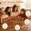 A family relaxing together painting autumn-themed art on wooden boards with paint and brushes.