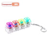 A set of transparent LED keyboard keycap fidget flashlights packaged as a keychain for stress relief
