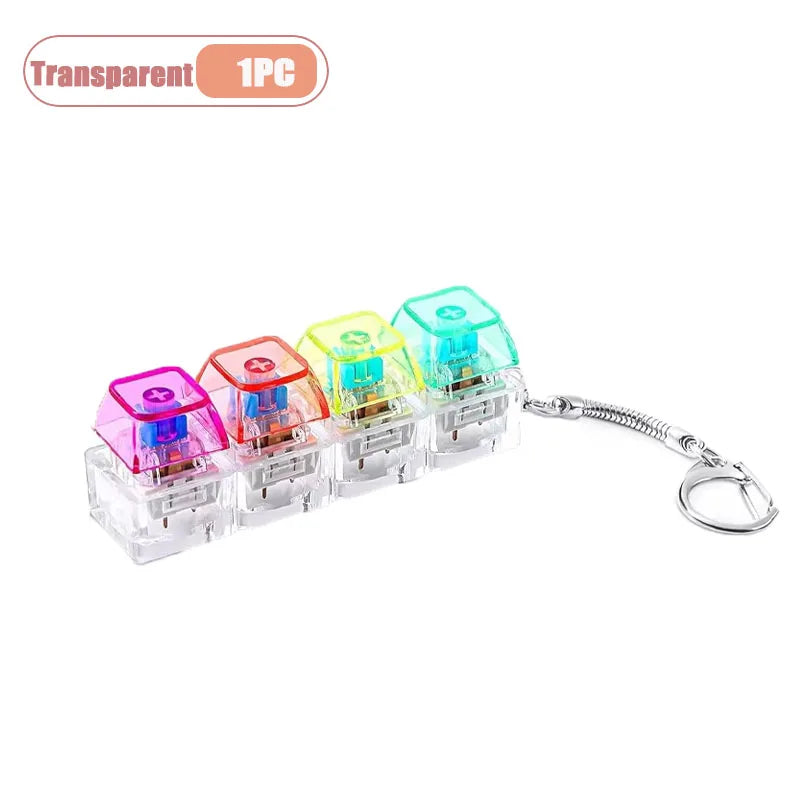 A set of transparent LED keyboard keycap fidget flashlights packaged as a keychain for stress relief