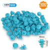 A pile of light blue plastic construction pieces for a kids activity kit including various shapes and tools