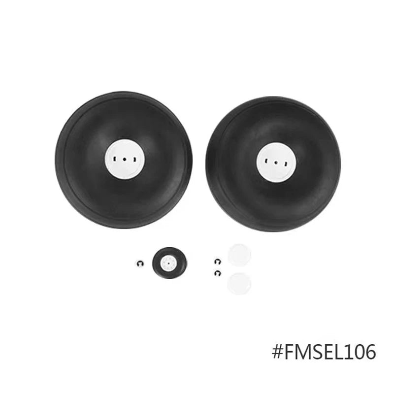 A pair of black, circular discs with central holes, part of a replacement kit for an RC airplane.