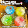 A collection of colorful fruit slush squishy stress relief balls on a glass plate.