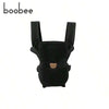 Black ergonomic 4-in-1 baby carrier with adjustable straps.