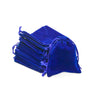 A royal blue compact drawstring dice bag with gathered fabric and visible drawstrings.