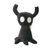 A black plush doll resembling a small creature with white eyes and horns.