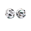 A pair of round silicone beads with a black and white leopard print design for jewelry making