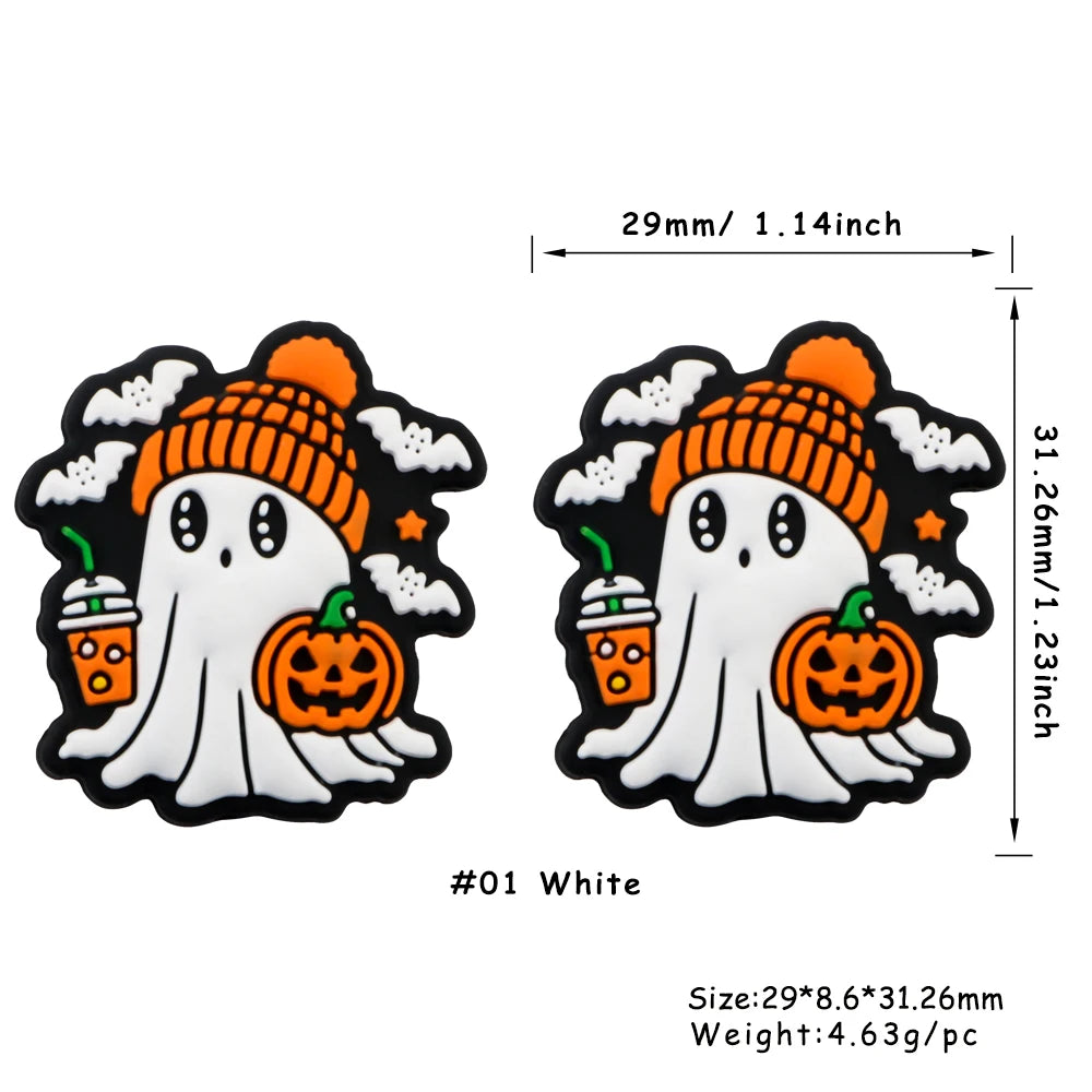 White silicone bead featuring a ghost face with an orange knitted hat and pumpkin accents