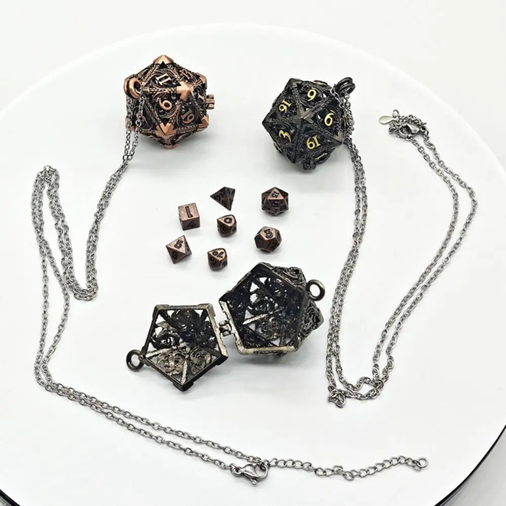 A set of metal polyhedral dice including a cube and a dodecahedron, displayed with accompanying chains and a pendant storage 