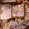 A collection of vintage stickers and paper elements for crafting, including floral designs and textured papers.