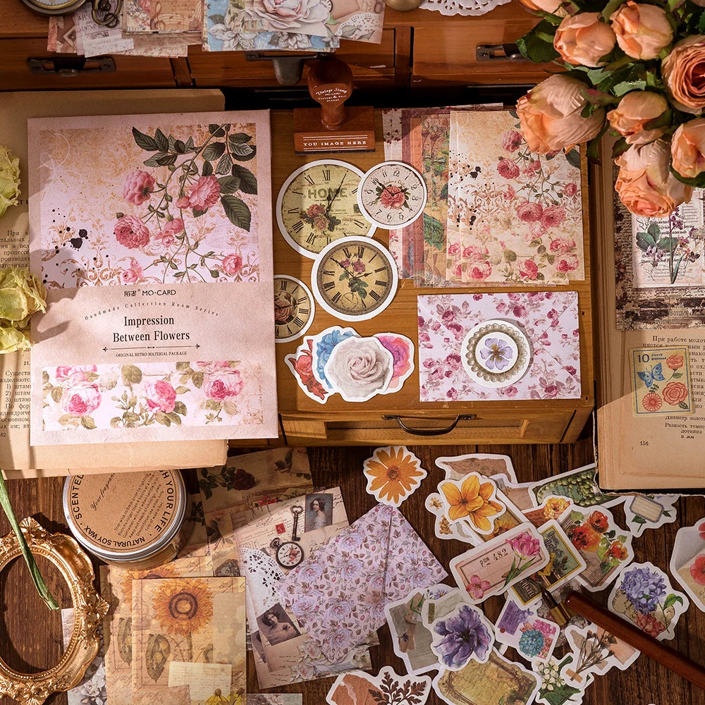 A collection of vintage stickers and paper elements for crafting, including floral designs and textured papers.
