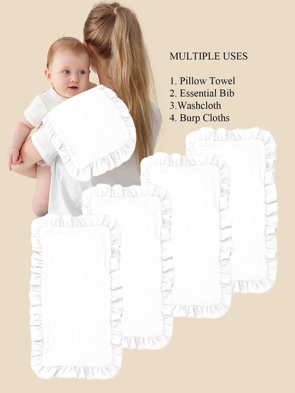 A set of four white muslin ruffle burp cloths displayed next to a baby and a woman.