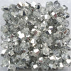A pile of clear faceted glass bicone beads for jewelry making
