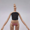 A fashion doll wearing a black sequined top and pink panties, standing against a light gray background.