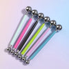 A set of four clay sculpting tools with silver balls and colored handles for pottery and crafting.