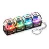 A set of four colorful LED light-up keyboard fidget toys attached to a silver keychain.