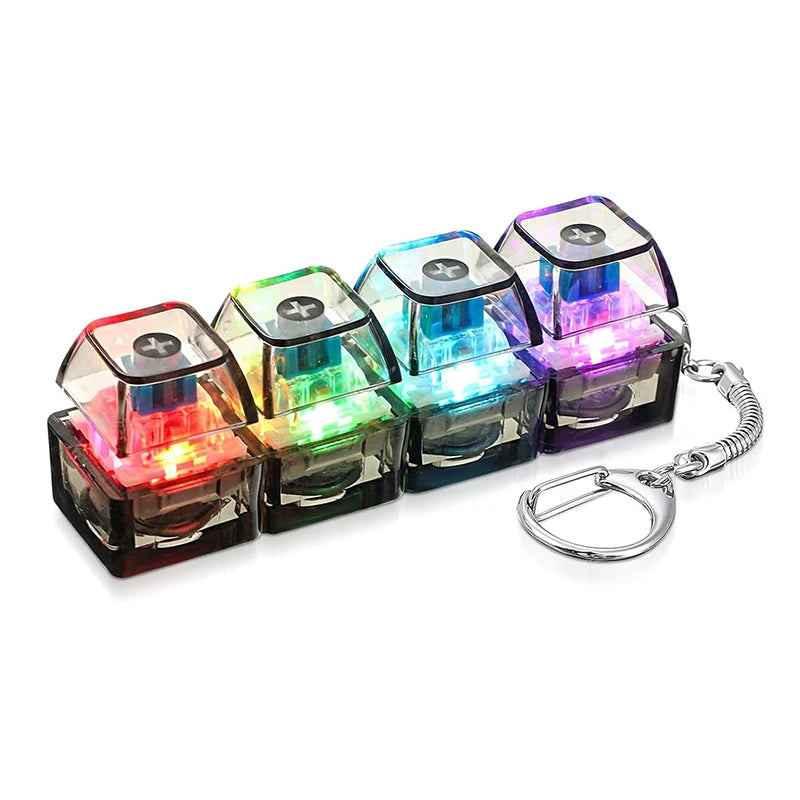A set of four colorful LED light-up keyboard fidget toys attached to a silver keychain.