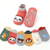 A pack of six pink and gray cotton cartoon animal socks with non-slip grips.