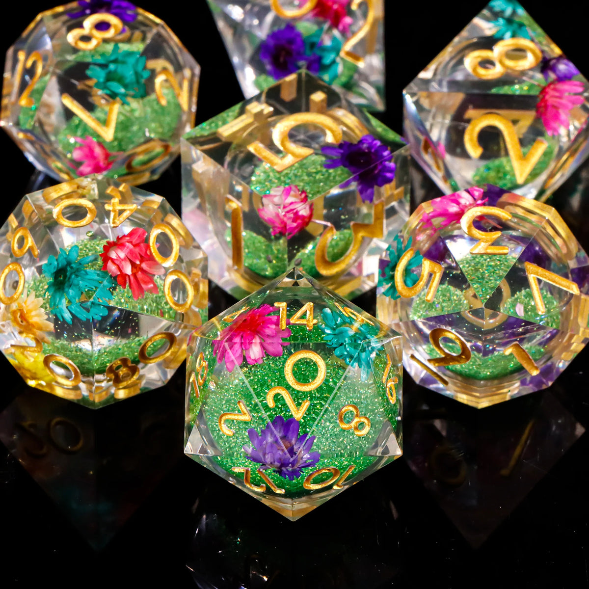 A collection of liquid core polyhedral dice set for Dungeons & Dragons showing various colored and glittered dice.