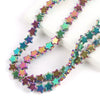 A strand of iridescent, multi-colored glass star spacer beads for jewelry making