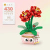 A set of red floral bouquet building blocks featuring yellow accents and a green plant base.