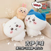 A set of Chiikawa Hachiware and Usagi plush dolls, soft white and blue, sitting on a light-colored sofa.
