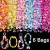 A colorful mix of acrylic beads in various shades including pink, purple, yellow, and blue for DIY jewelry making.